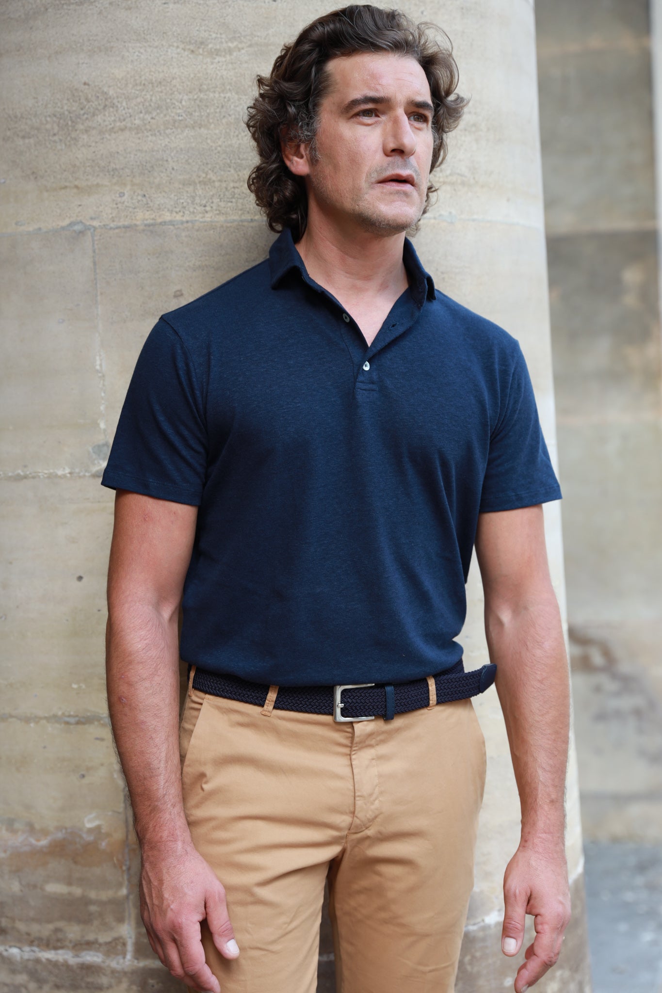 navy blue polo shirt and khaki pants